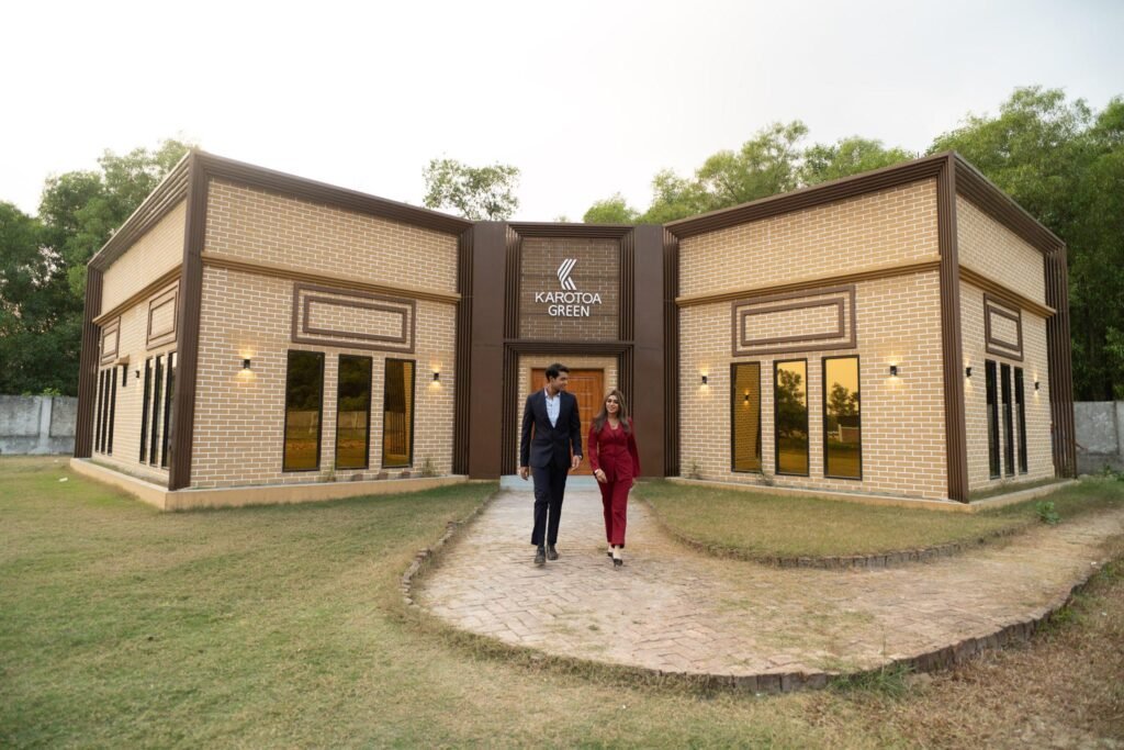 Karotoa Green resort exterior with couple walking in Gazipur